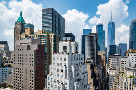 New York City lower Manhattan skyline view with skyscrapers and blue sky in the day, USAの写真素材