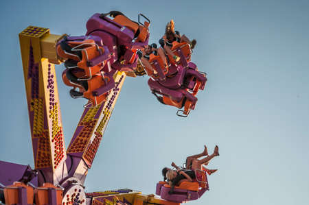 OLD ORCHARD BEACH, MAINE - AUGUST 24, 2014: People enjoy the theme park playland, which is a Compact, beachfront amusement park with a Ferris wheel, roller coaster & more, In Old Orchard Beach Maineのeditorial素材