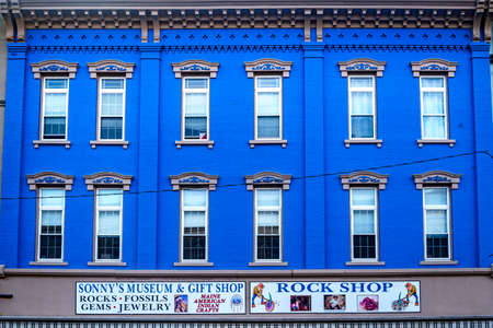 AUGUSTA, MAINE - OCTOBER 16, 2021: Brightly colored store fronts and buildings in the historical...