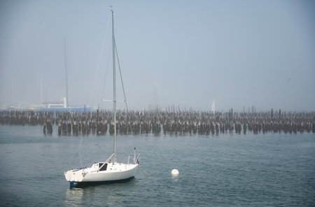 Portland Harbor in Maine, Sailboats during a foggy day. USAの写真素材