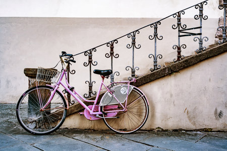 vintage bicycle with wooden crate, bike leaning on a wall in Italian street in Lucca, Italyの写真素材