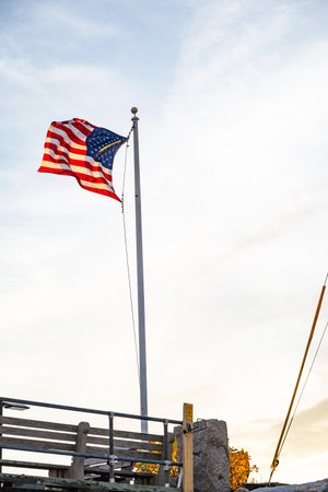 American flag with water on the backgroundの写真素材
