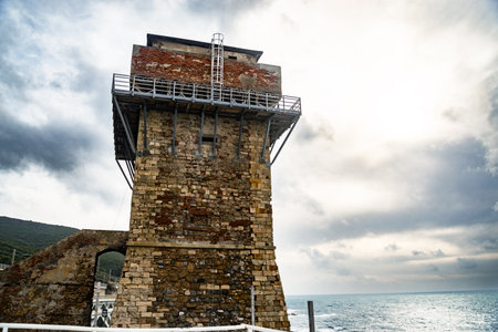 Calafuria Tower landmark on cliff rock and sea in winter. Livorno, Tuscany, Italy, Europeの写真素材