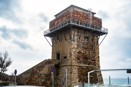 Calafuria Tower landmark on cliff rock and sea in winter. Livorno, Tuscany, Italy, Europeの写真素材