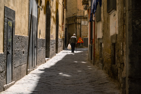 Naples, Italy May 3, 2025: Naples, a journey through the beautiful historic center, a World Heritage Site among alleys, shops and people.の写真素材
