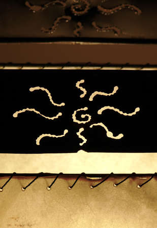 detail of a lit table lamp, materials include canvas and copperの写真素材