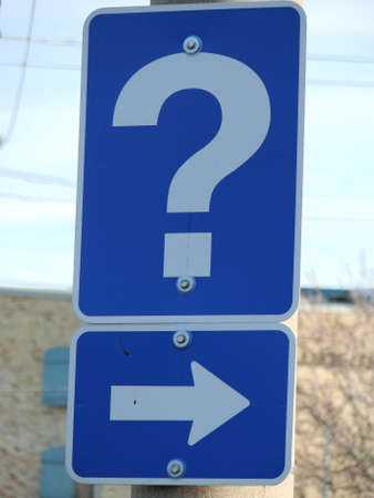 a street sign with a question markの写真素材