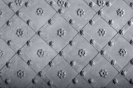 Pattern on a metal studded doorの写真素材