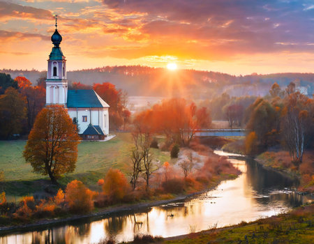 Church on the bank of the river at sunrise. Beautiful autumn landscape.の素材