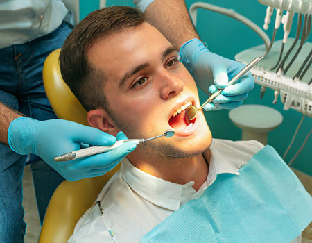 Dentist and patient at the dental surgery. Dentistry concept.の素材