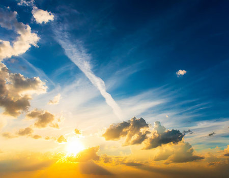 Sunset sky background with tiny clouds. Sunset sky background with tiny cloudsの素材
