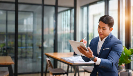 Businessman working with digital tablet in the office. Business concept.の素材