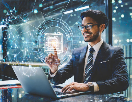 Portrait of young Indian businessman using laptop with digital circuit interface on blurry city background. Technology and innovation concept. Double exposureの素材