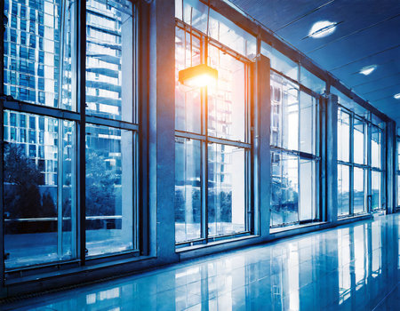 interior of modern office building,blue toned image with sunbeamの素材