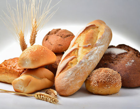assortment of baked bread on the white background, food closeupの素材