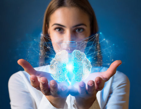 The concept of artificial intelligence. A young woman in a business suit holds a hologram of a human brain in her hands.の素材