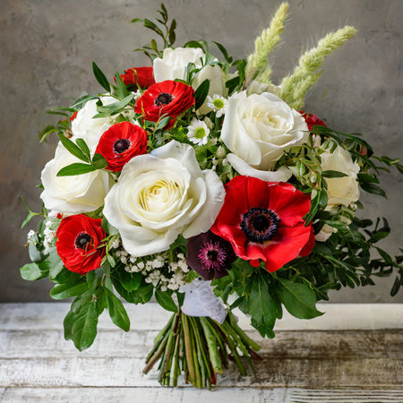 Bouquet of white and red anemones, poppies and eustoma flowersの素材