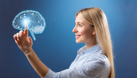 Young businesswoman working with virtual projection of brain on a blue backgroundの素材