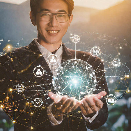 Portrait of young asian businessman holding social network icons in his hands. Double exposureの素材