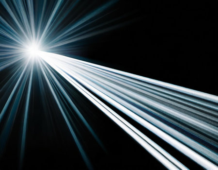 lights of cars moving at high speed on a sunny day with a lens flareの素材