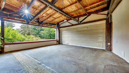 Empty garage with garage doors and concrete floor. View of the garageの素材