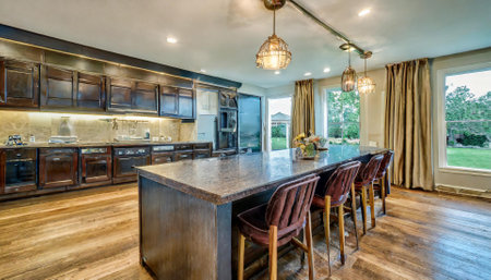 Kitchen with oak wood floor and granite countertop. Northwest, USAの素材