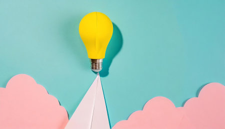 Paper airplane and light bulb on blue background. Creative idea concept.の素材