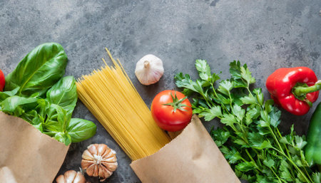 Fresh ingredients for cooking pasta on stone background. Top view with copy spaceの素材