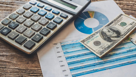 calculator and money on the table, business concept of financeの素材