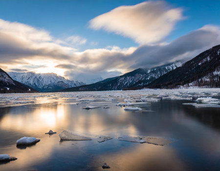 Winter landscape with frozen lake and mountains at sunset, Siberia, Russiaの素材