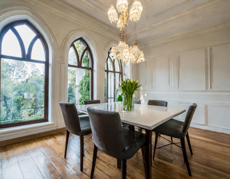 Interior of a luxury dining room with wooden floor and white wallsの素材