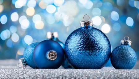 blue christmas balls with decoration on shiny backgroundの素材