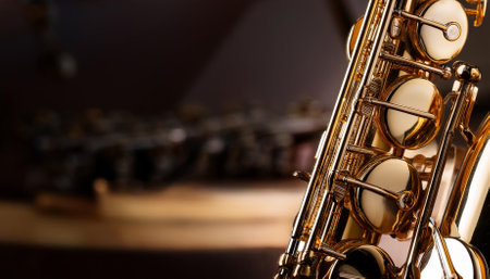close up of a shiny saxophone highlighting its intricate keys and metallic finishの素材