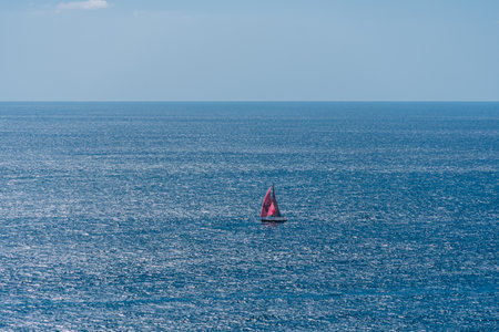 sailboat sailing offshore with the power of the air