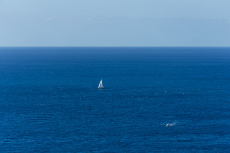 sailboat sailing offshore with the power of the air