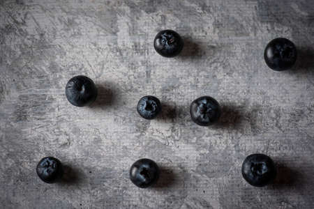 Fresh blueberries on a vintage gray table. Closeup to blueberriesの写真素材