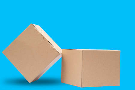 Cardboard boxes with blue background. Boxes for parcel shipping with minimalist design