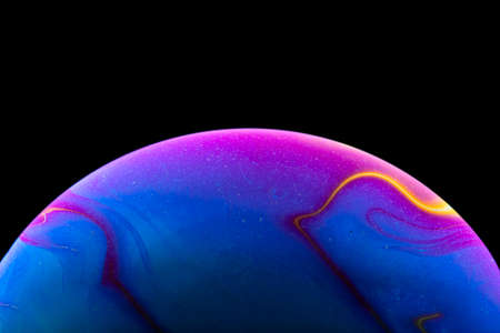 Soap bubble simulating the atmosphere of a planet with different shapes, colors and a black...