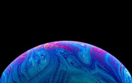Soap bubble simulating the atmosphere of a planet with different shapes, colors and a black...