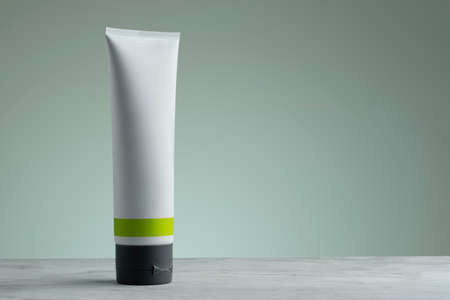 Cream container with a green gradient background