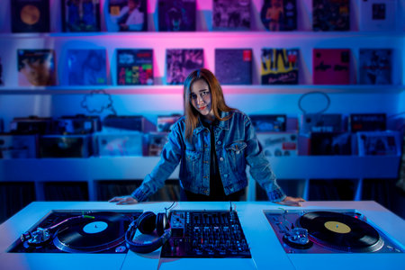 Young latin dj woman mixing music in a vinyl record store. Retro music concept with vinyl records