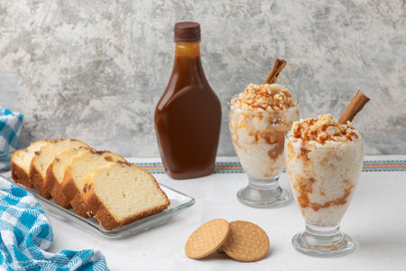 Mexican breakfast of rice pudding, cookies and bread with caramel, on a tableの写真素材