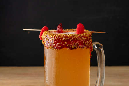 close up of michelada in a jar with light beer and gummiesの写真素材