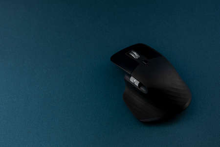 computer mouse with blue color background and space for textの写真素材