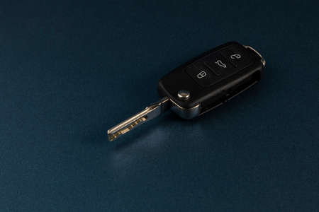 Car keys with blue background and space for text