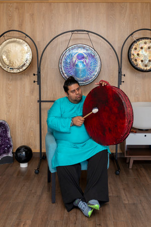 Musician engaging in sound healing with instrumentsの写真素材