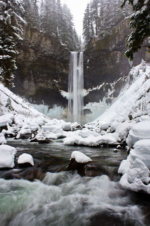 Beautiful waterfall during the winterの写真素材