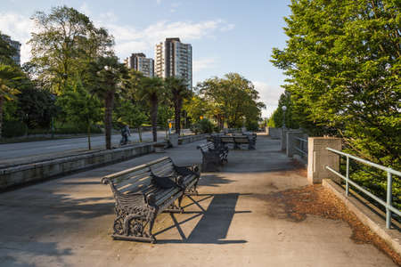 Benches at the English Bay Beach. Taken in Downtown Vancouver, British Columbia, Canada, on a sunny early morning.の写真素材