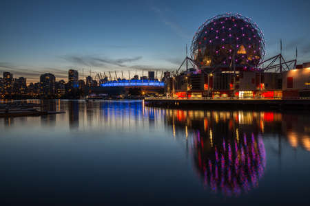 View of Downtown Vancouver at Science World with the Stadium in the Background. Taken in Vancouver, British Columbia, Canada, after sunset.の写真素材