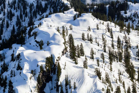 Aerial landscape view of the snow covered mountain peak North of Vancouver, British Columbia,...